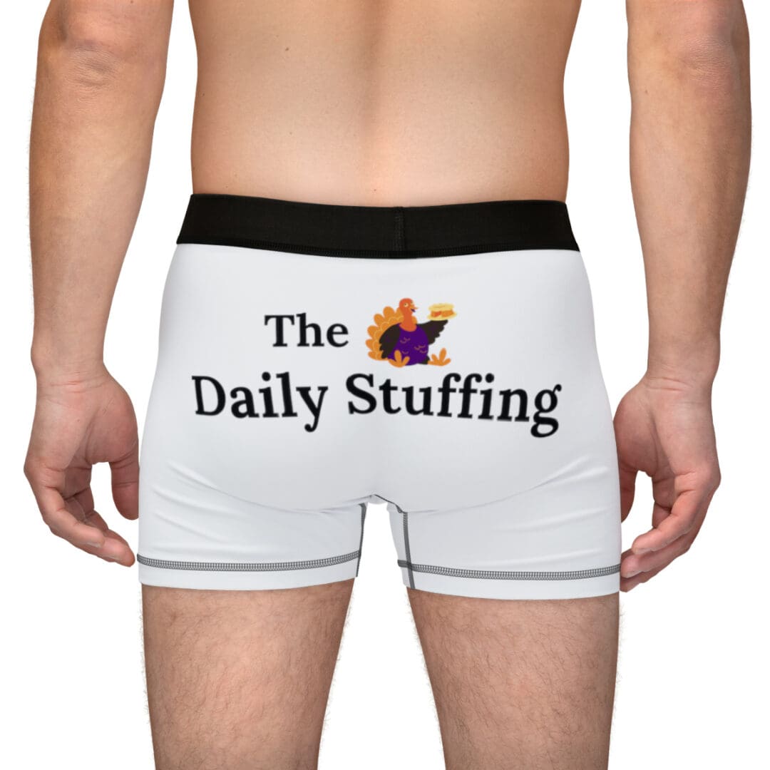 A man wearing white boxers with the words " the daily stuffing ".