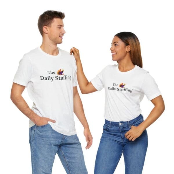 A man and woman wearing white shirts with the daddy novelist logo on them.