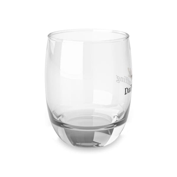 A glass is sitting on the ground