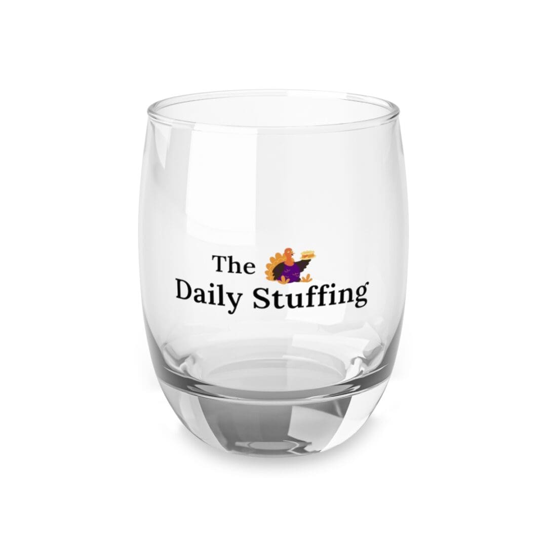 A glass with the daily stuffing logo on it.