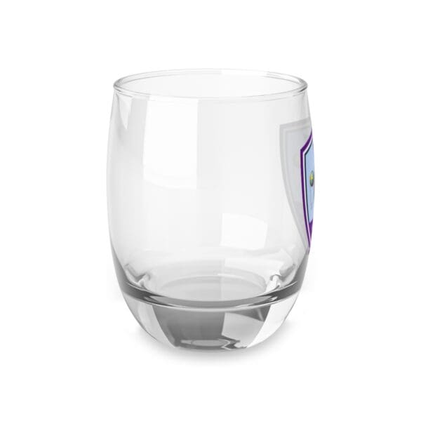 A glass with purple and blue stickers on it.