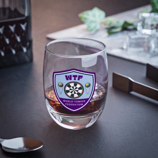 A glass with the wtf logo on it